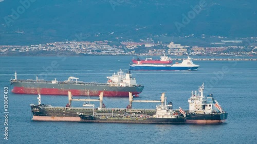 Generic Tanker Cargo Ships in Bay of Gibraltar Calling at the Port during Transit of of the Strait with Algeciras Spain in the Background