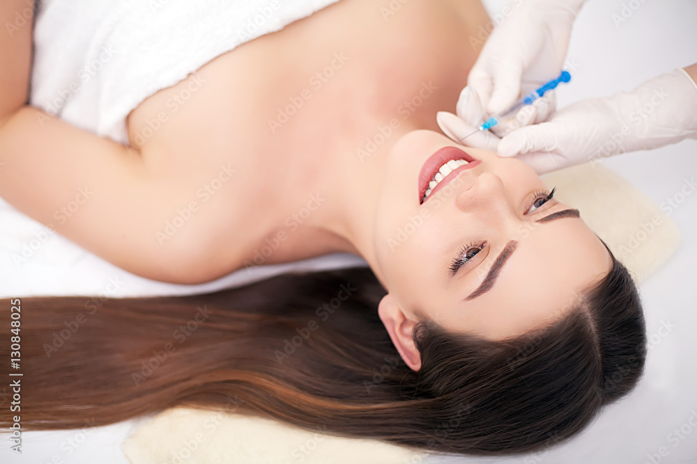 Woman Having Injection In Lips As Beauty Treatment Woman Having Injection In Lips As Beauty Treatment