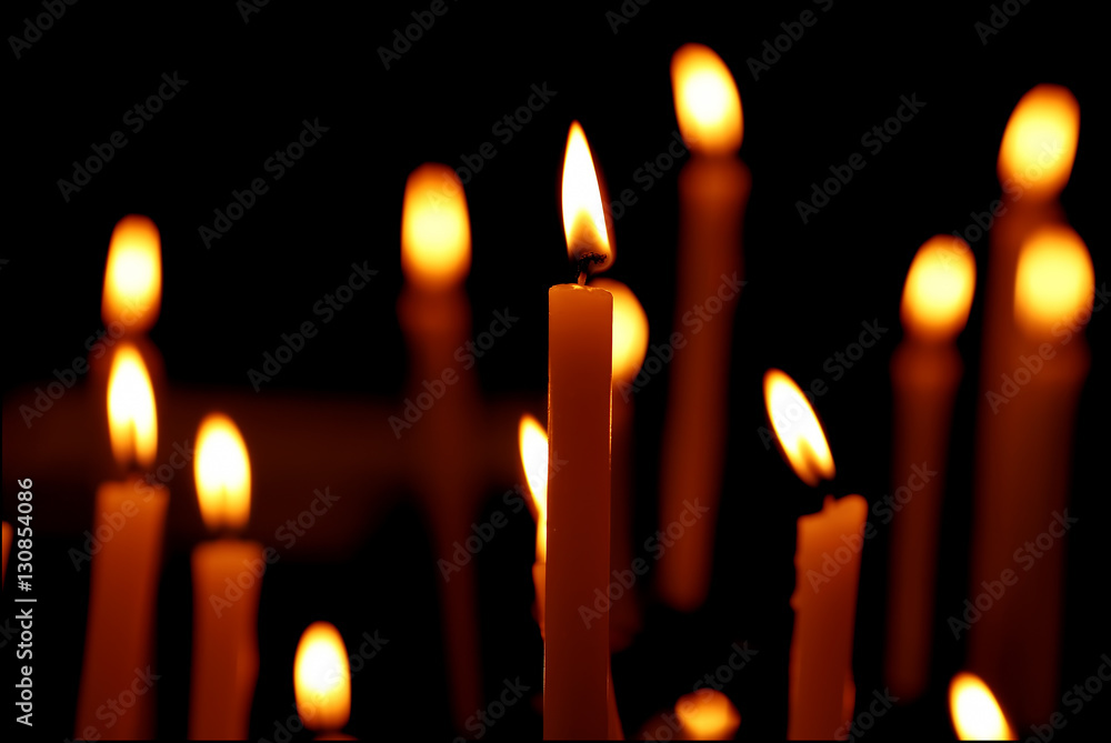 Burning candles over black background Burning candles over black background