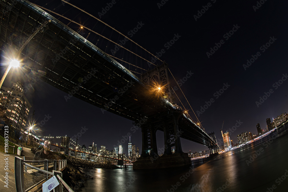 Under the Manhattan bridge at night in New York
