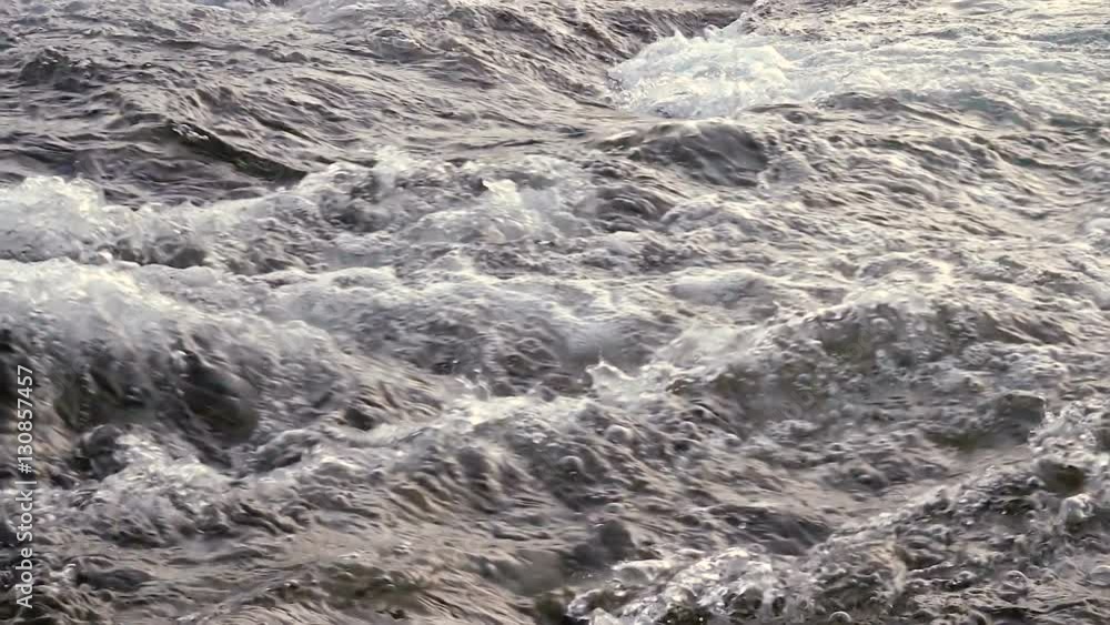 Flowing water in slow motion at sunrise