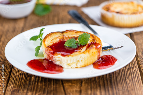 Cheesecake with Sauce on vintage wooden background