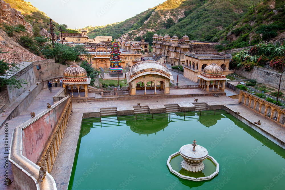 Monkey temple (galtaji) in Jaipur, India. A natural spring emerges high on the hill and flows downward, filling a series of sacred kunds in which pilgrims bathe