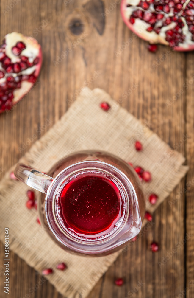 Fresh made Pomegranate juice on rustic background Fresh made Pomegranate juice on rustic background