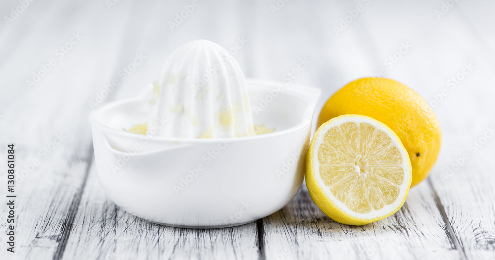 Fresh made Lemon Juice on a rustic background Fresh made Lemon Juice on a rustic background