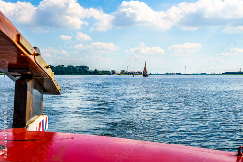 Rudder of a Historic Botter Boat on the Veluwemeer near the town of Bunschoten-Spakenburg in the Netherlands photo