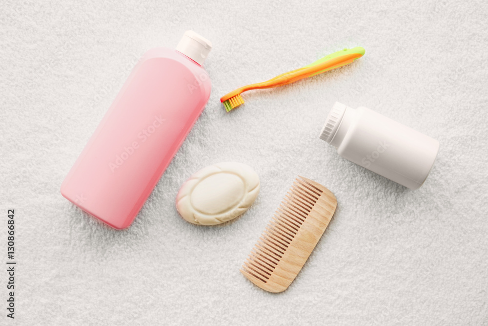 Baby accessories for bathing on towel, flat lay Baby accessories for bathing on towel, flat lay