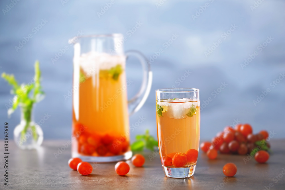 Cold grape cocktail and fresh berries on blurred background Cold grape cocktail and fresh berries on blurred background
