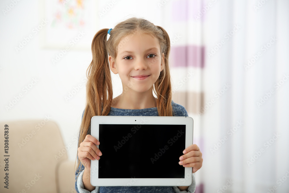 Cute girl with tablet computer at home Cute girl with tablet computer at home