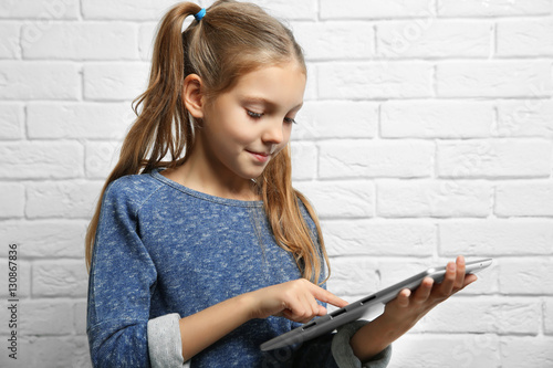 Cute girl with tablet compu...
