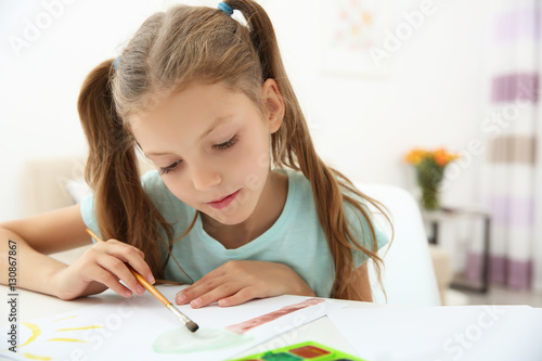 Cute girl painting picture ...