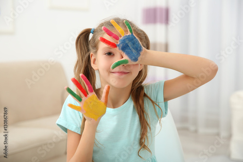 Cute girl with palms in pai...
