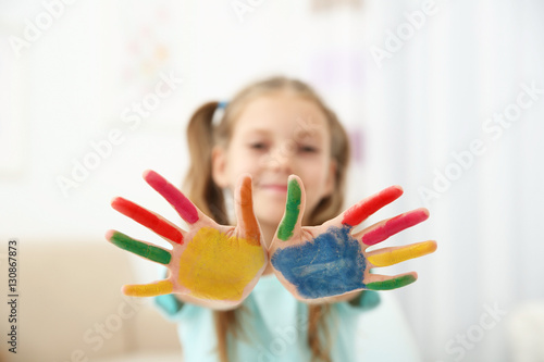 Cute girl with palms in pai...