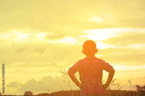 Child asian looking sunshine view.Child lonely and sad with mountain view in holiday.