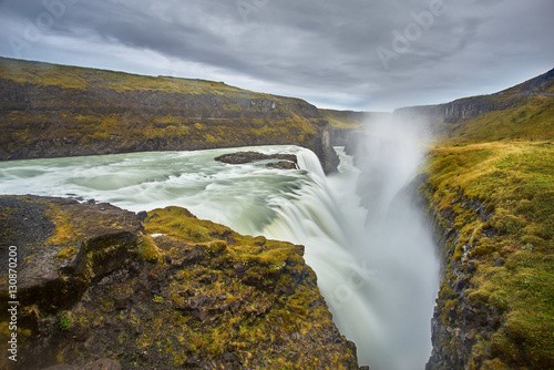 cloudy sunrise with the stunning waterfall at Gullfoss waterfall, iceland 