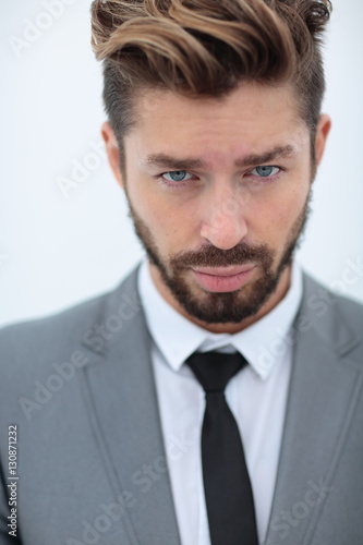 Close up portrait of a smiling handsome business man  over white