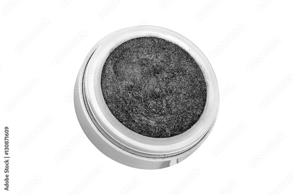 Dark grey color eyeshadow powder with glitter particles, in round grey open container, beauty product isolated on white background Dark grey color eyeshadow powder with glitter particles, in round grey open container, beauty product isolated on white background