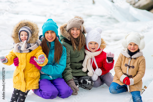 Group of young girls sitting at the ice block