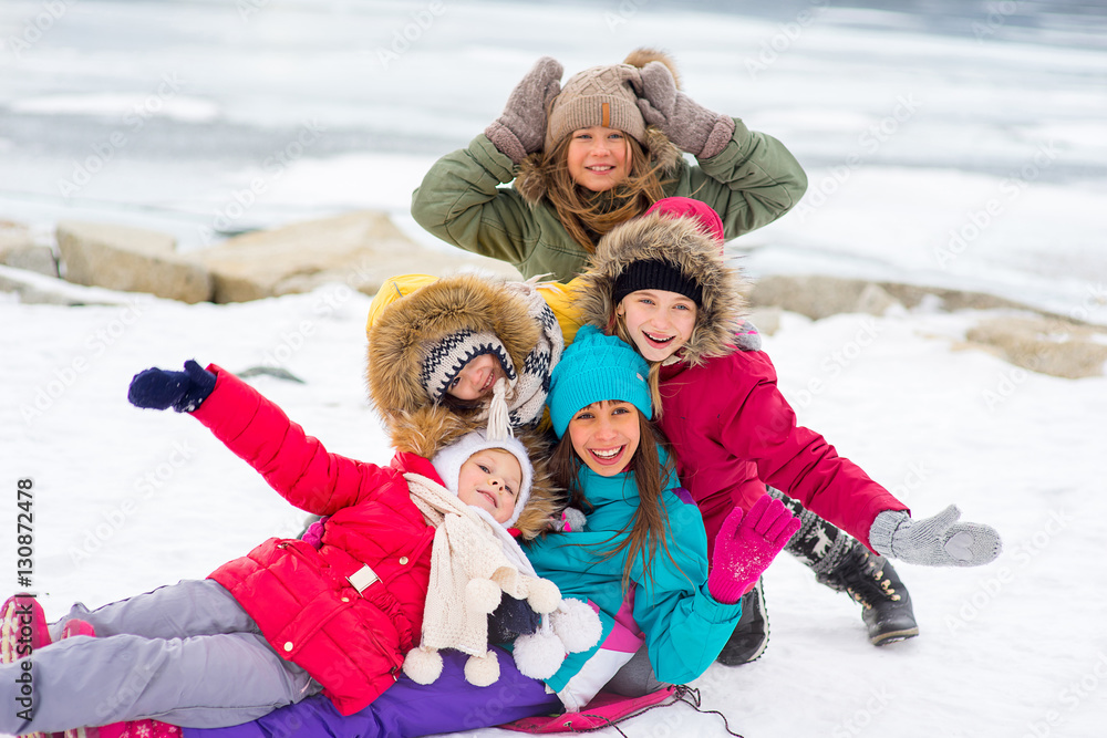 Group of young girls on the frozen lake