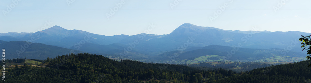 Horizontal wide angle panorama of forests and mountains near Bukovel ski resort