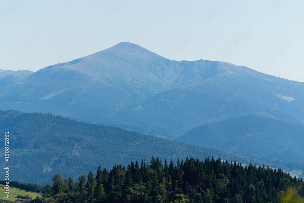 Isolated on blue sky mountain peaks