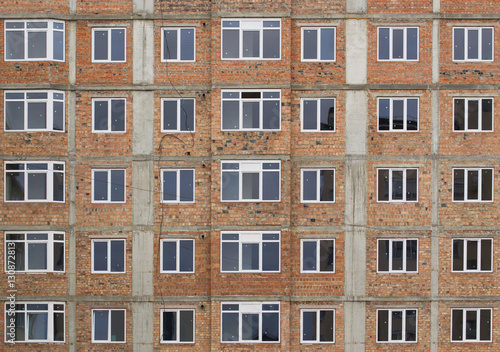 New building without facing. Red brick wall