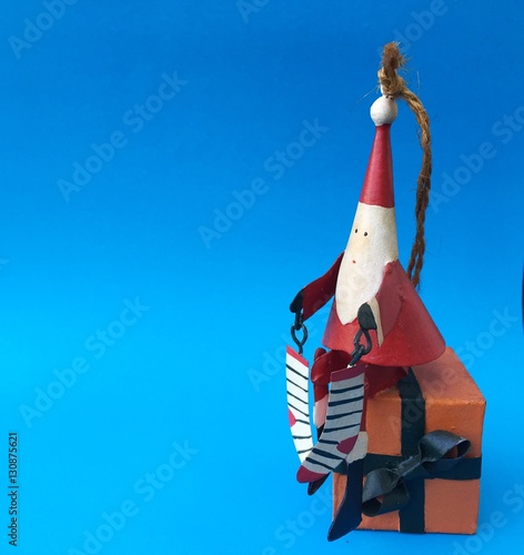 Santa Claus home decoration toy Merry christmas on blue background photo