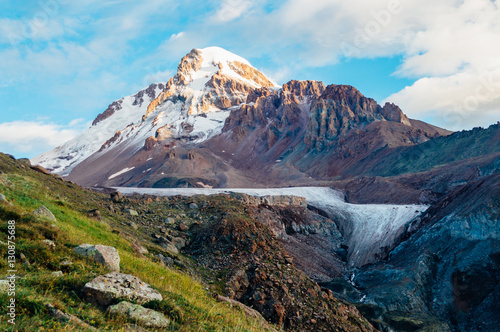 Mount Kazbek and dirty Gergeti glacier early in the morning near Stepantsminda, Georgia