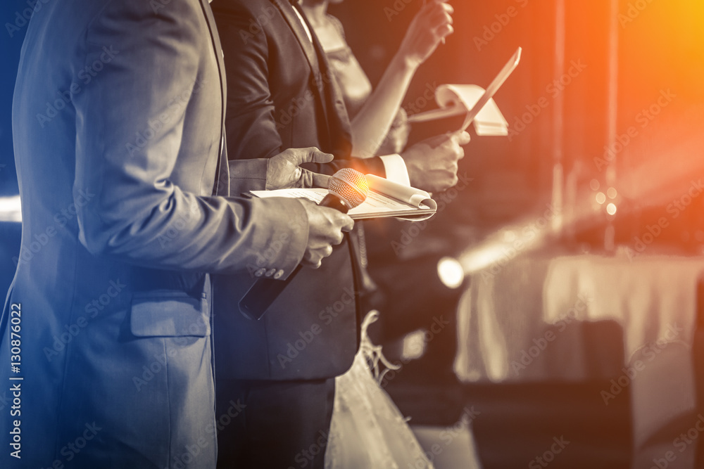 Obraz premium Master of ceremonies with microphone on stage