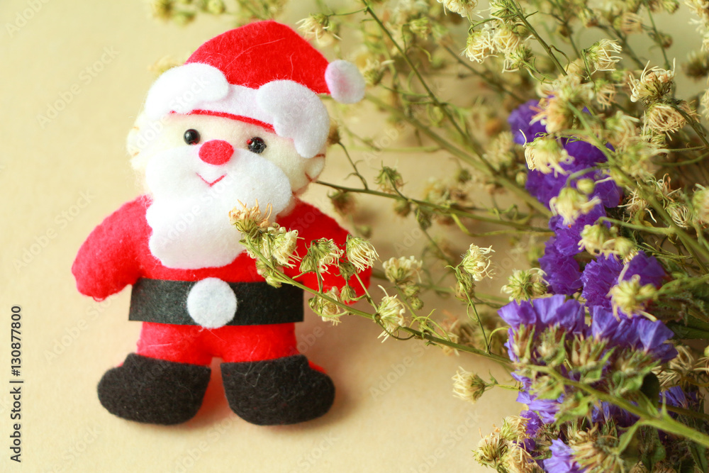 Santa doll with flowers. 