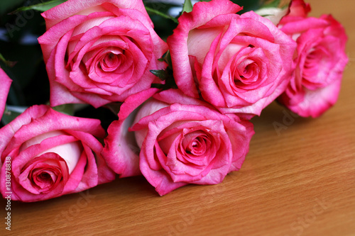 A bouquet of flowers  composed of roses.