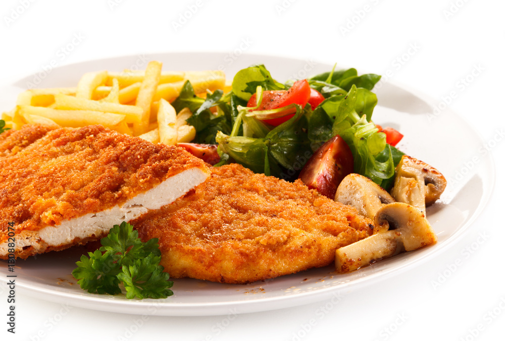 Fried pork chop, French fries and vegetables Fried pork chop, French fries and vegetables