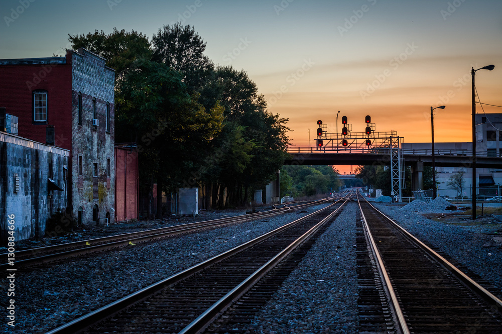 Fototapeta premium Railroad tracks at sunset, in downtown Greensboro, North Carolin