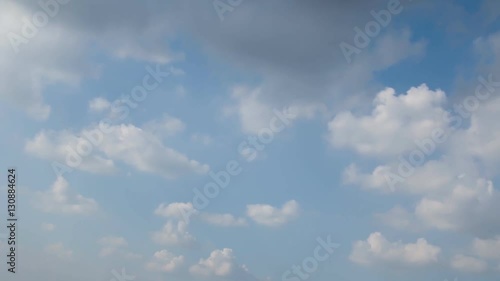Fluffy white clouds on sky with a bright ,Slow-moving,Time Lapse.