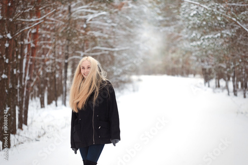 girl in the winter woods on a snowy road © makam1969