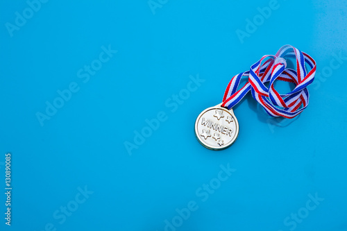 Gold medal. Winner medallion with red white and blue ribbon and