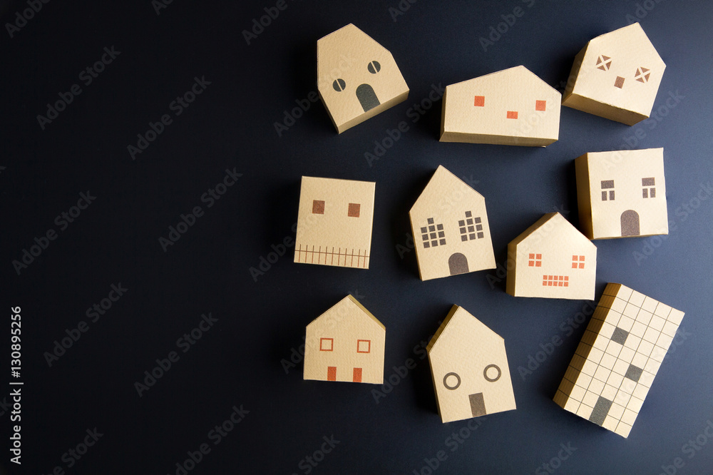 Home architectural model paper box cubes on black background wit Home architectural model paper box cubes on black background wit