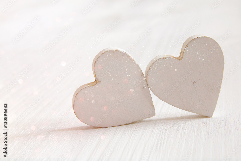 Obraz premium Valentines day background. Couple of wooden hearts