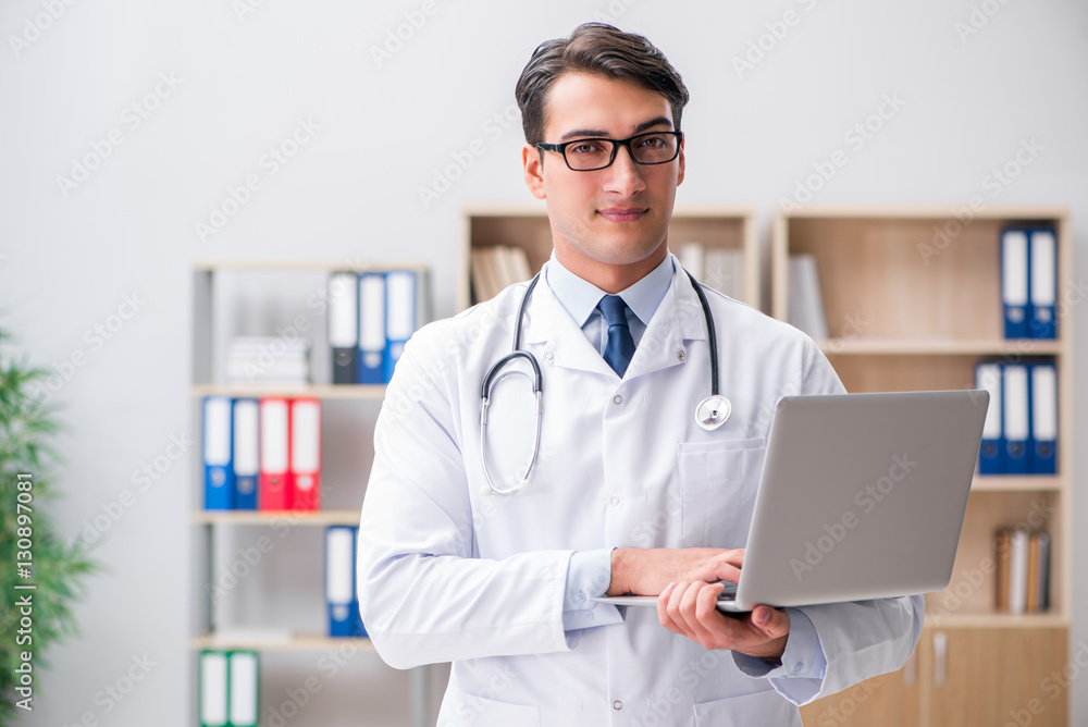 Young adult doctor with laptop computer Young adult doctor with laptop computer