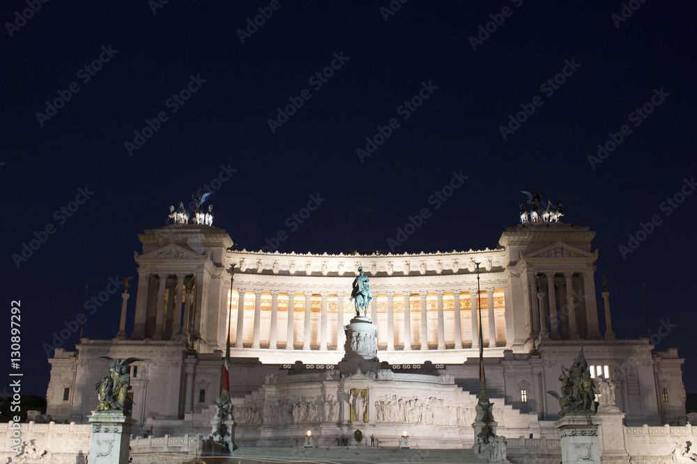Night view of Altar of the Fatherland captured from Piazza Venezia in Rome. Grand marble, classical temple honoring Italy's first king & First World War soldiers.
