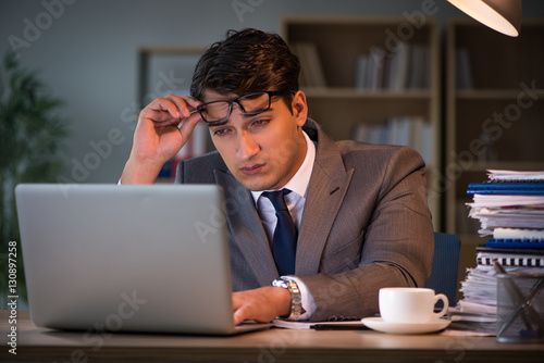 Businessman staying in the office for long hours