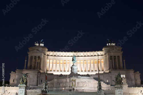 Night view of Altar of the Fatherland captured from Piazza Venezia in Rome. Grand marble, classical temple honoring Italy's first king & First World War soldiers.