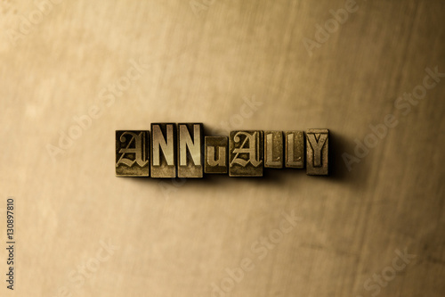 ANNUALLY - close-up of grungy vintage typeset word on metal backdrop. Royalty free stock - 3D rendered stock image.  Can be used for online banner ads and direct mail.