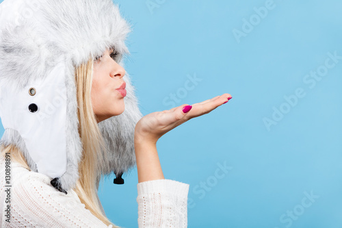 Woman wearing winter furry warm hat