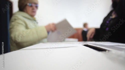 A person casts her ballot during voting for parliamentary elections at a polling station in Bucharest, Romania.