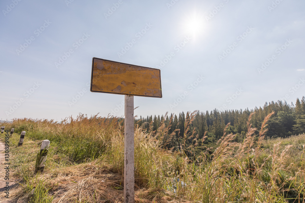 Empty signboard on the side of road in rural area
