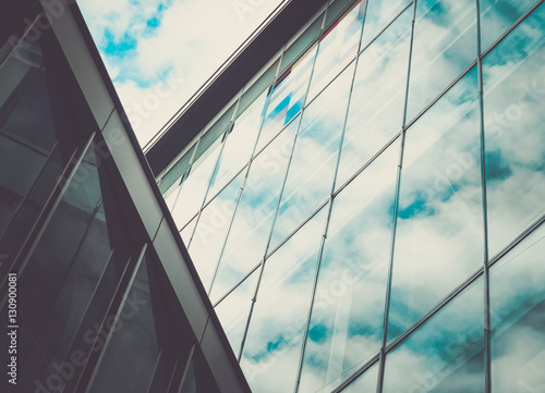 Reflection of sky on modern glass building background