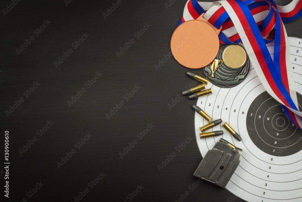 Shooting competition. Award winners. Biathlon victory. Ammunition and winners medals in biathlon