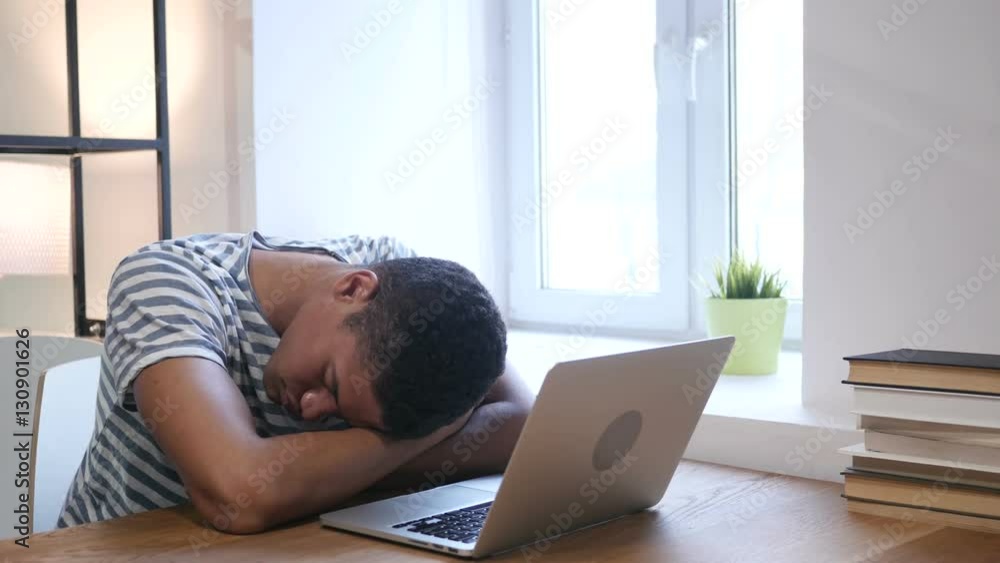 Sleeping Black Man at Work, Head on Desk Sleeping Black Man at Work, Head on Desk