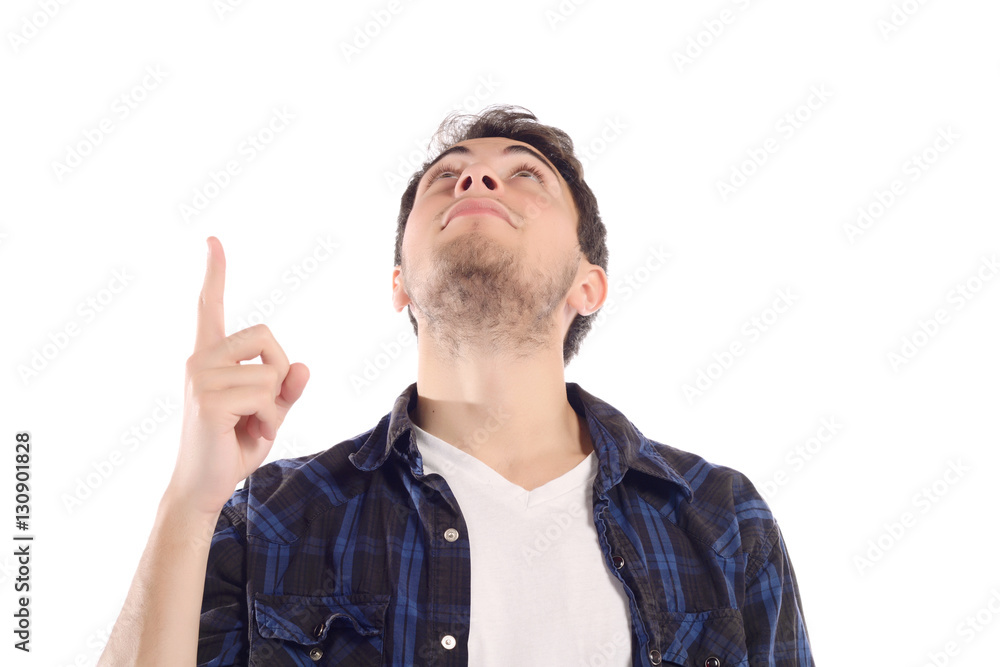 Attractive young man pointing up. Attractive young man pointing up.